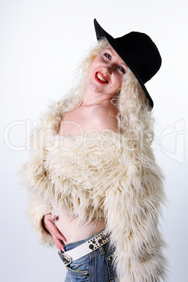 Curly blonde in a black hat and white fluffy fur coat