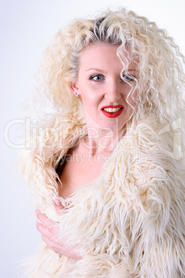 Curly blonde in a white fluffy fur coat