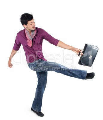 young businessman strikes foot for the briefcase on the white