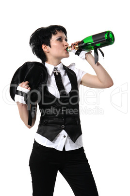 Bride drinking from a bottle of champagne