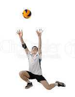 Volleyball player with the ball on a white