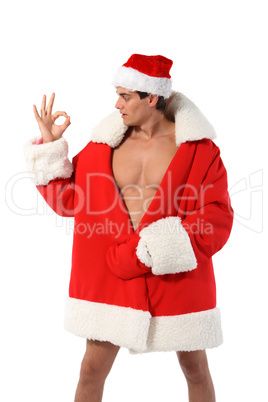 Sexy muscular man wearing a Santa Claus hat isolated on white