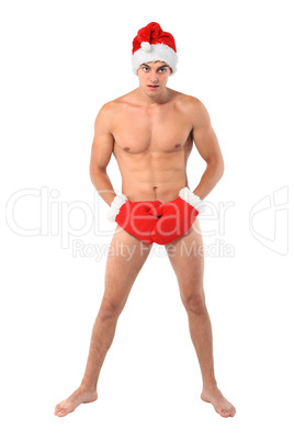 Sexy muscular man wearing a Santa Claus hat