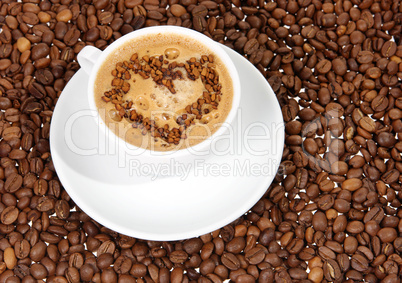 coffee mug against the backdrop of coffee beans