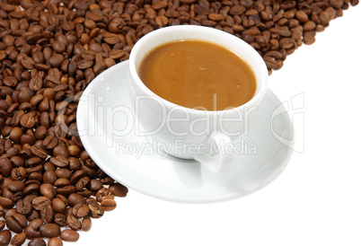 coffee mug against the backdrop of coffee beans