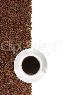coffee mug against the backdrop of coffee beans
