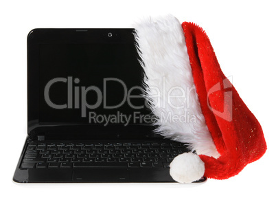Santa Claus hat on a computer on the white