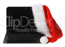 Santa Claus hat on a computer on the white