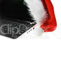 Santa Claus hat on a laptop on the white