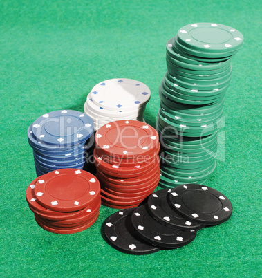 Casino chips on a green table