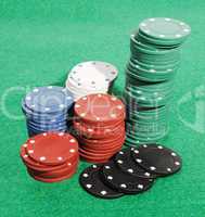 Casino chips on a green table