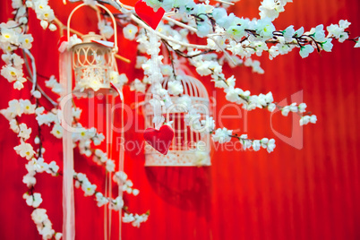 Installation of wedding hearts, sakura flowers and cages