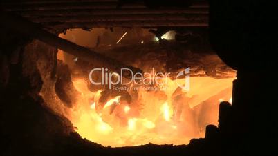 melting iron in metal production plant