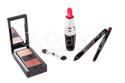 Red open lipstick, shadows and pens isolated on white