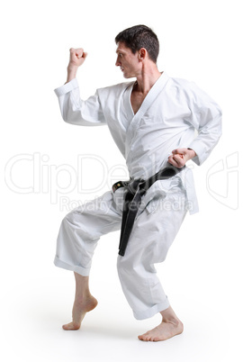 Karate. Man in a kimono with a white background