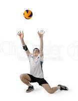 Volleyball player with the ball on a white