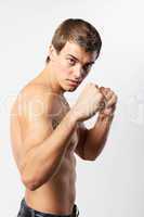 young man boxer on the white
