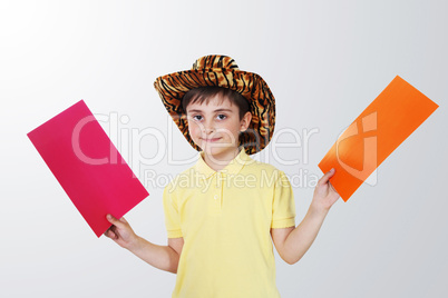 boy with colored paper in his hands