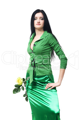 Young beautiful girl in green with a yellow rose