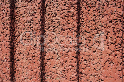 texture of the red stucco