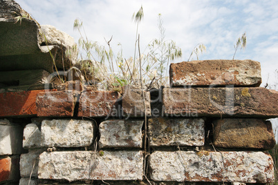 Old brick wall against the blue sky