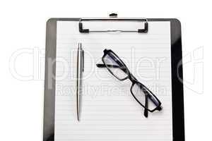 Note pad, pen and glasses on a white background
