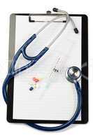 Note pad wth blue stethoscope and pills