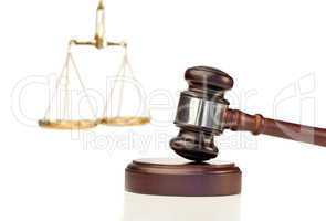 Gavel in action and scale of justice