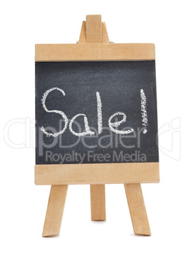 Chalkboard with the word sale written on it