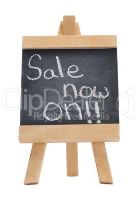 Chalkboard with the words sale now on written on it