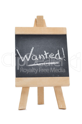 Chalkboard with the word wanted written on it