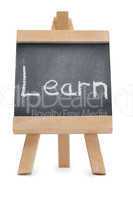 Chalkboard with the word learn written on it