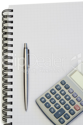 Notebook with pencil and pocket calculator
