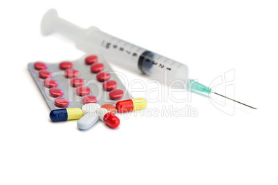 Blister strip with pills and syringe