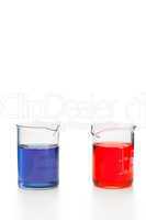 Blue and red liquid in beakers