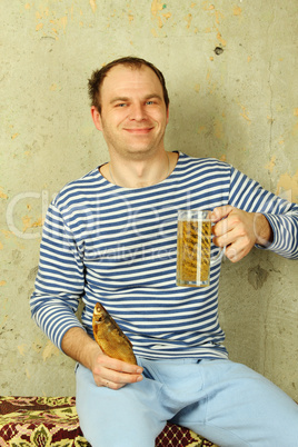 Closeup of a man with a glass of beer