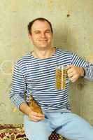 Closeup of a man with a glass of beer