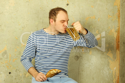 Closeup of a man with a glass of beer