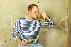 Closeup of a man with a glass of beer