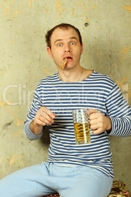 Closeup of a man with a glass of beer