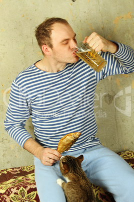 Closeup of a man with a glass of beer