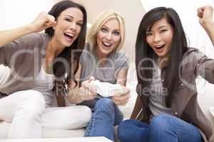 Three Beautiful Women Friends Playing Video Games at Home