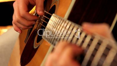 man playing guitar close up 2