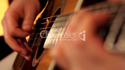 man playing guitar close up
