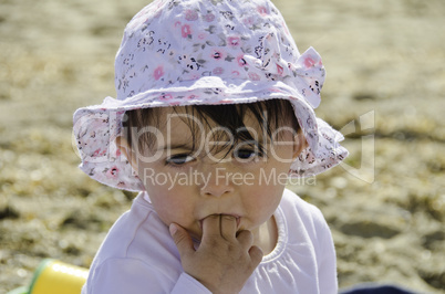 Baby Girl relaxing on the Beach