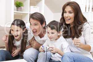 Happy Family Having Fun Playing Video Console Games