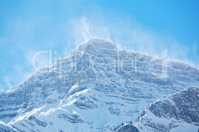 Snow spindrift on mountain peak 05