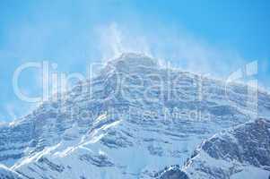 Snow spindrift on mountain peak 05