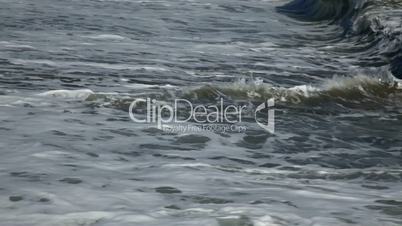 Surf on a sandy beach