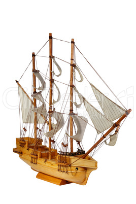 Model of ship with sails on the white background